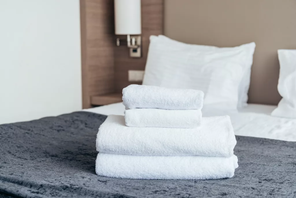 A-Diana cleaning & detail llc offers services of Residential Cleaning, Deep Cleaning, Move Out In Cleaning, Airbnb Cleaning, Construction Cleaning, Office Cleaning, Floor Cleaning, Spring Clean Up, Leaf Removal, Weed Control in Johns creek, Atlanta, Alpharetta, Dunwoody, Conyers, Stone Mountain - Residential Cleaning folded white towels on bed in hotel room